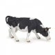 Black and white grazing cow figurine