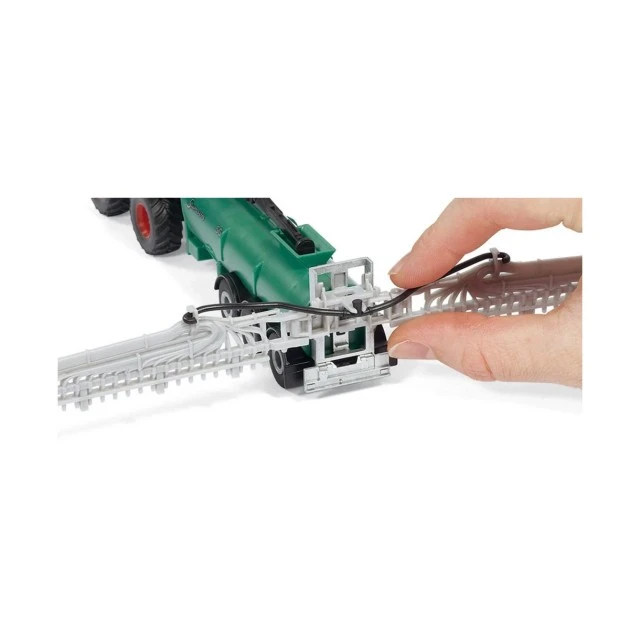 Toy tractor with vacuum tank