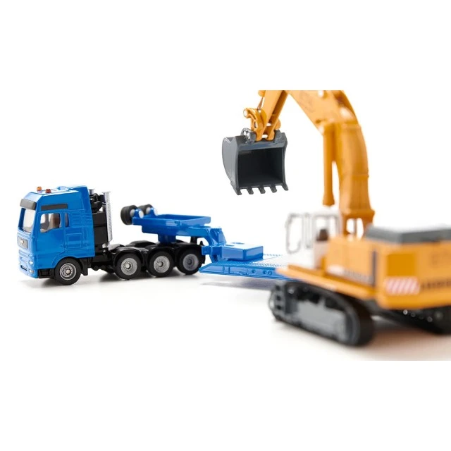 Low loader and excavator