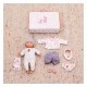 Baby doll toy in a suitcase with clothes and accessories