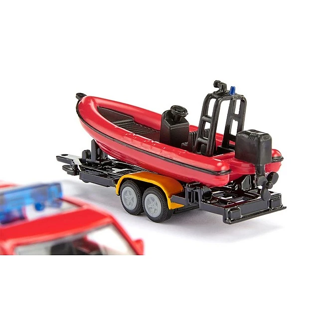 Toy fire truck Land Rover towing boat