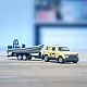 Land Rover Defender "Safari" toy with towbar and boat