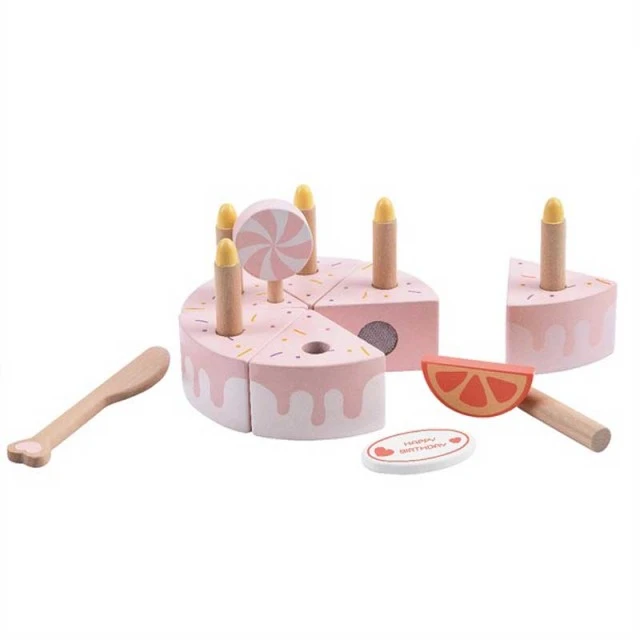 Children’s cake made of wood with pastel pink candles