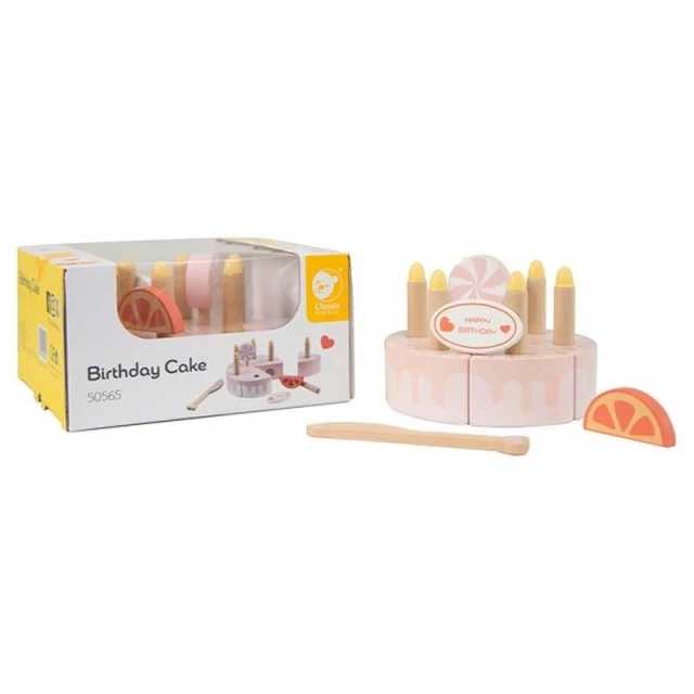 Children’s cake made of wood with pastel pink candles