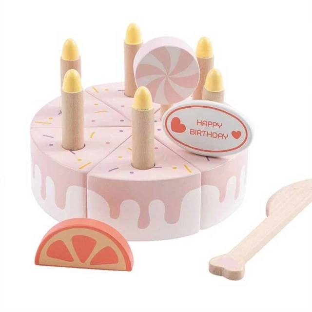 Children’s cake made of wood with pastel pink candles