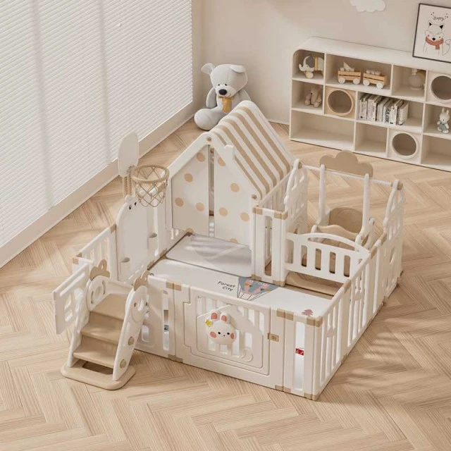 Children's indoor playground with fence, swing and active play elements
