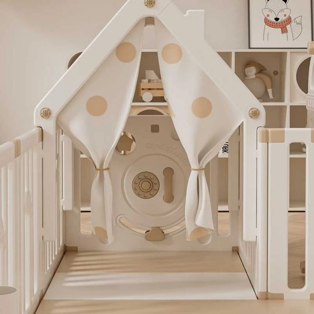 Children's indoor playground with fence, swing and active play elements