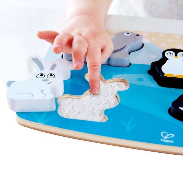 Wooden puzzle touch and recognize Polar animals
